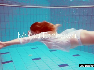 Cute Melissa plays underwater