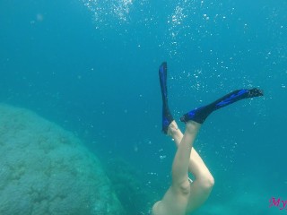 Girl with a perfect butt and tits swimming at open sea Maldives