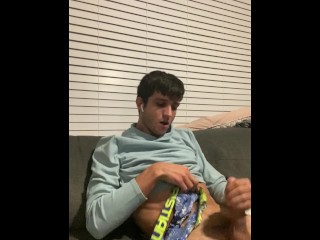 Hot stud jerks off on couch