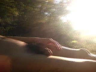 Natural teen boy lays nude by the river, wanks his hairy cock, squirts cum and relaxes during summer