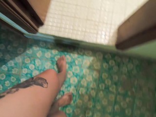 She is pissing standing to the toilet
