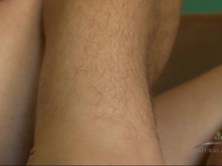 Unshaved woman combs her luscious body hair and massages her bushy cunt.
