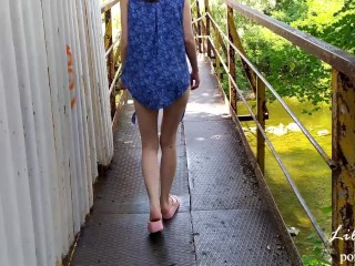 Walking naked along the river bank.