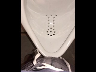 Wearing a Female to Male (FTM) Stand to Pee (STP) device, whipping it out to pee at a urinal 